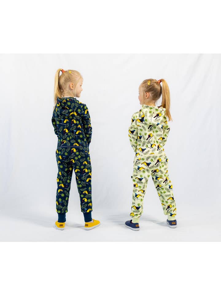 Warm jumpsuit with zipper rear, toucan print, blue for wholesale on Faire4