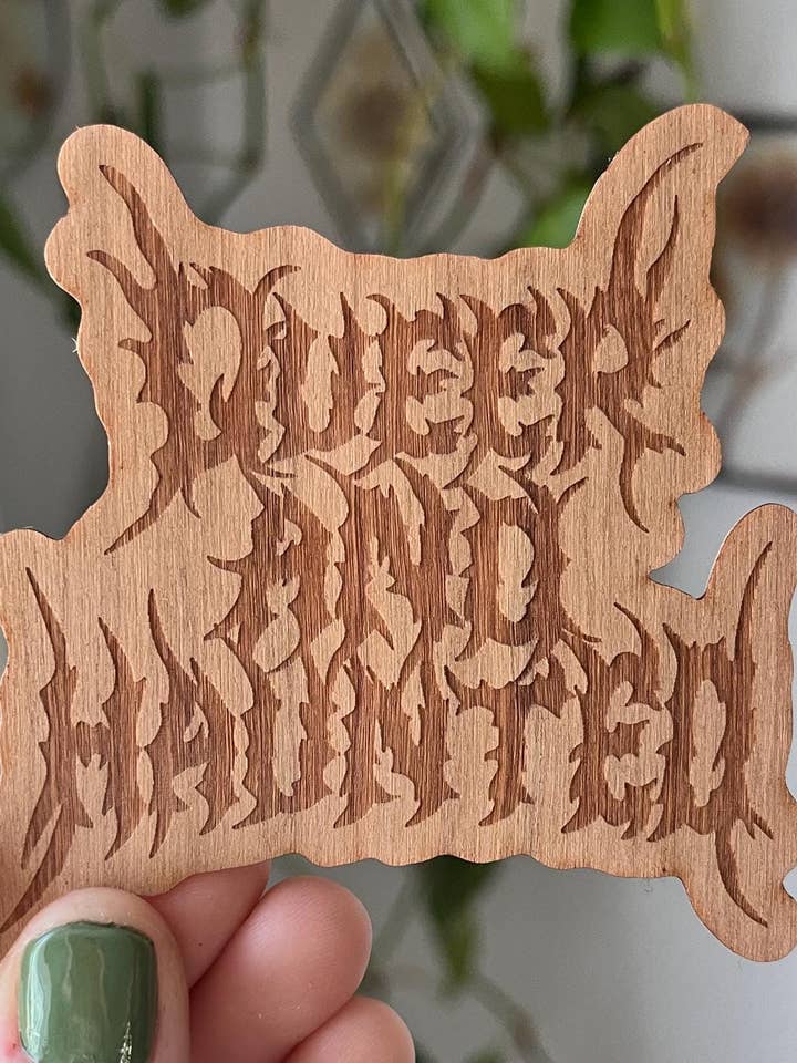 Queer & Haunted Laser Engraved Cherry Wood Sticker for wholesale by Owlhaired Designs