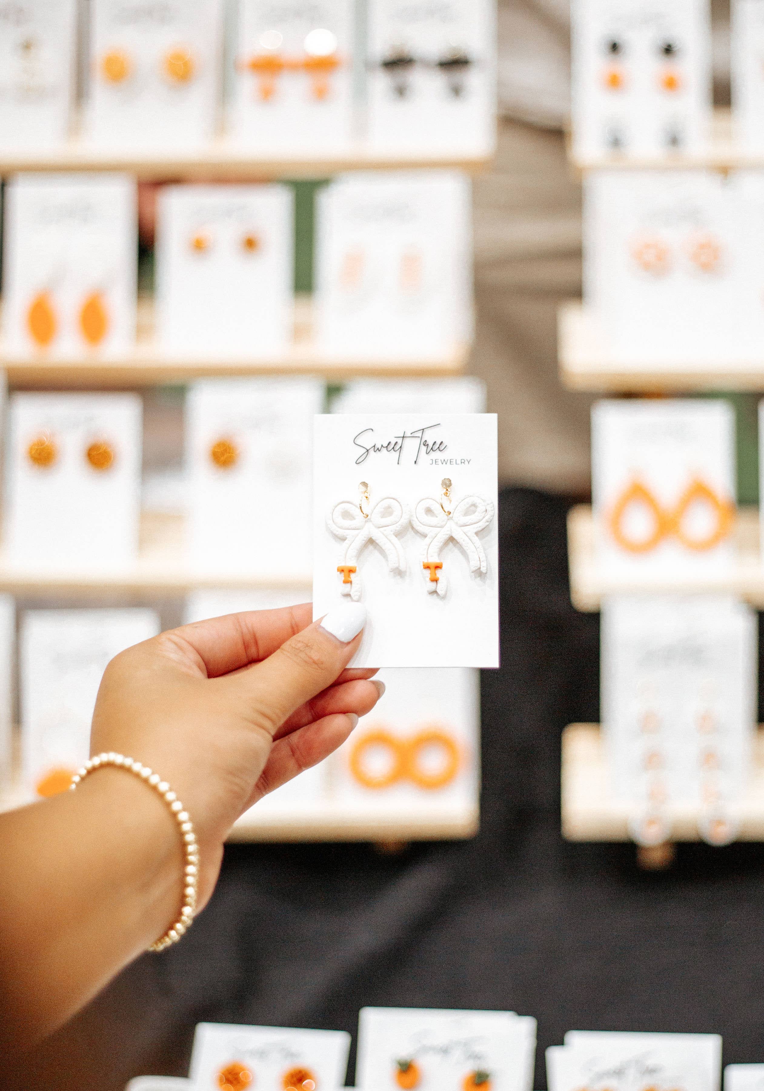 Sweet Tree - Wholesale Dangle Earrings - White and Orange Bow Jewelry | Gifts, Tennessee, Vols1