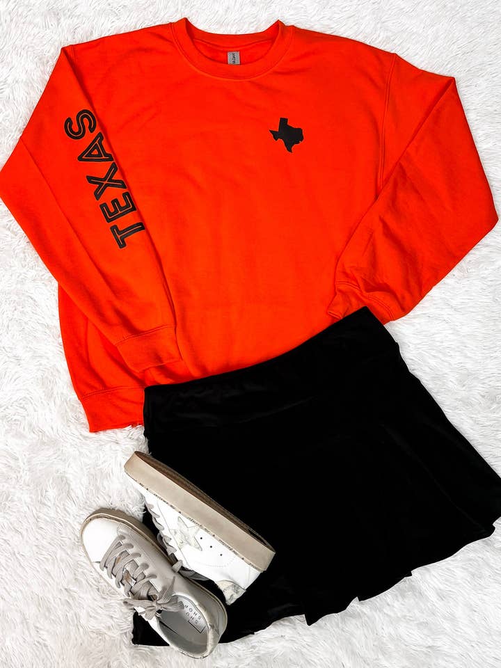 Felpa a girocollo arancione con grafica Texas per la vendita all'ingrosso da parte di Bizzy's Wholesale