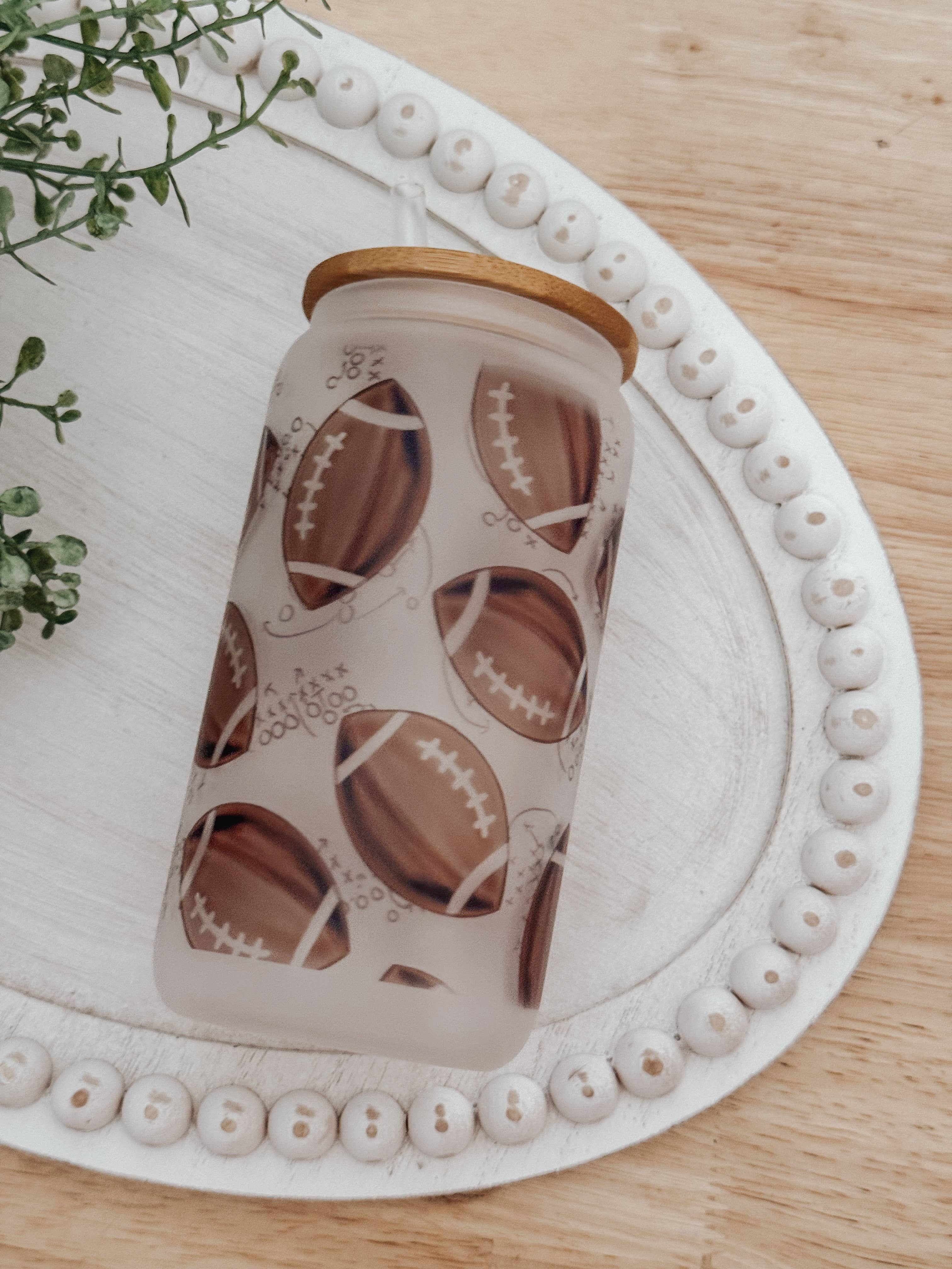 Onic Brands LLC - Wholesale Drinking Glass/Cup - Watercolor Footballs 16oz Glass Cup with Bamboo Lid1