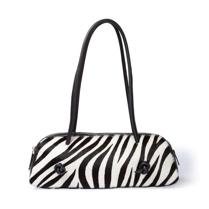 Grace pony borsa allungata in pelle di vitello stampa animalier con finiture in pelle liscia per la vendita all'ingrosso da parte di Roberta Gandolfi