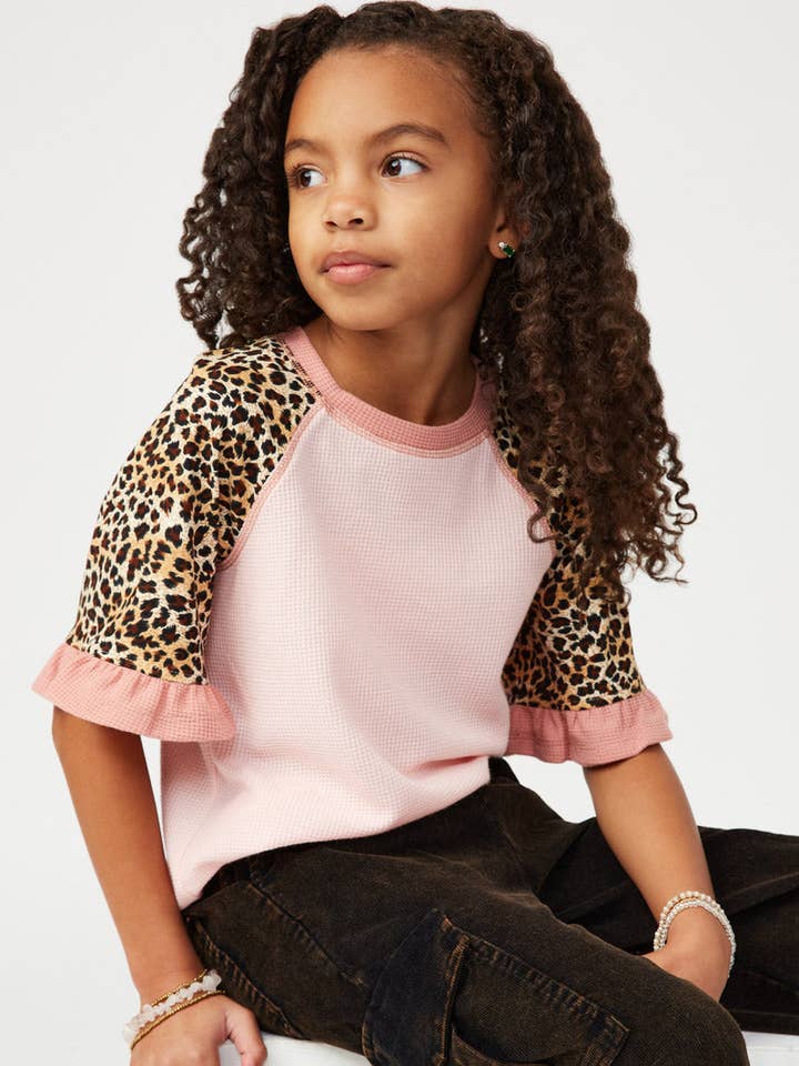 Smithsonian Cheetah Sleeve Raglan Knit Top for wholesale by Hayden LA