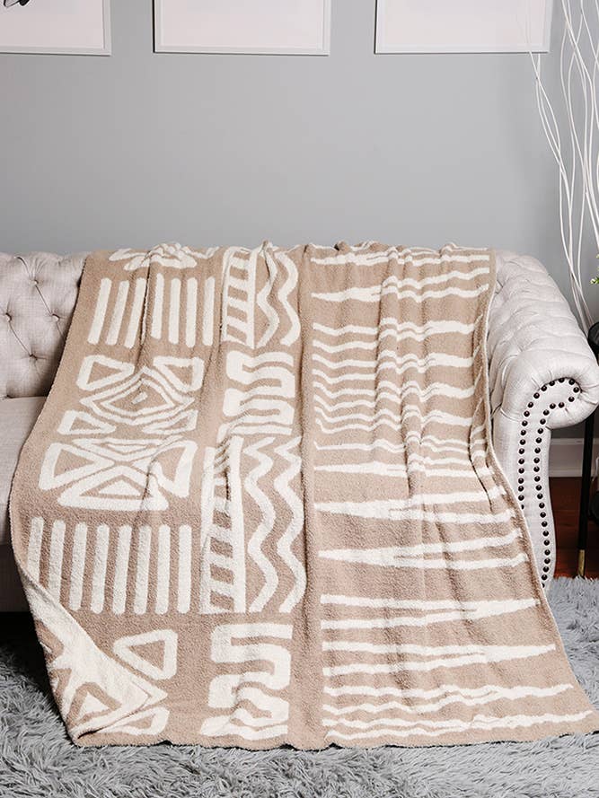 Coperta invernale reversibile con motivo Geo-Trib per la vendita all'ingrosso da parte di Hana