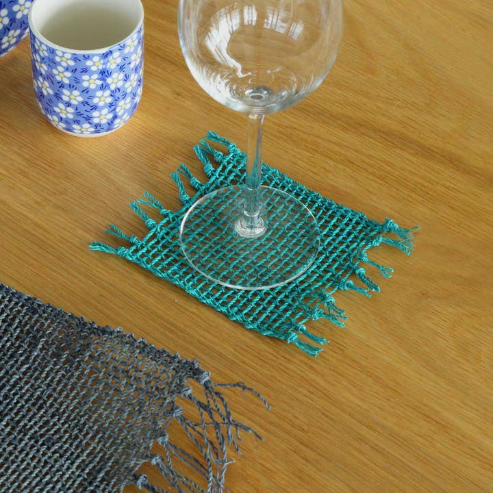 Set of 4 Turquoise Seagrass Fringe Natural Coasters for wholesale by Ancient Wisdom