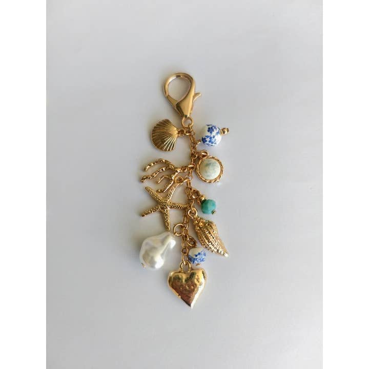 Gold PORCELAIN SEA LIFE PEARL HEART TURQ BEAD BAG CHARM | 80K009 for wholesale on Faire1