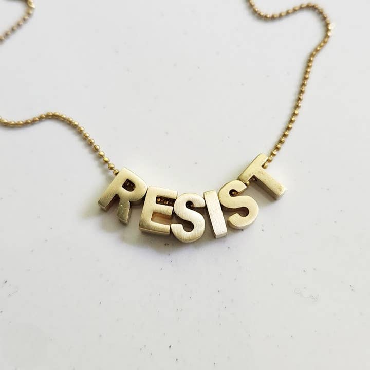 RESIST Girl Power Mantra Brass Block Letter Beaded Necklace and other Purchase Wholesale power block. Free Returns & Net 60 Terms on Faire trending on Faire.