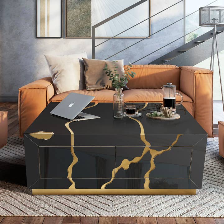 Moderne sort sofabord med guld accenter og fire skuffer for engroshandel hos Amazing Rugs