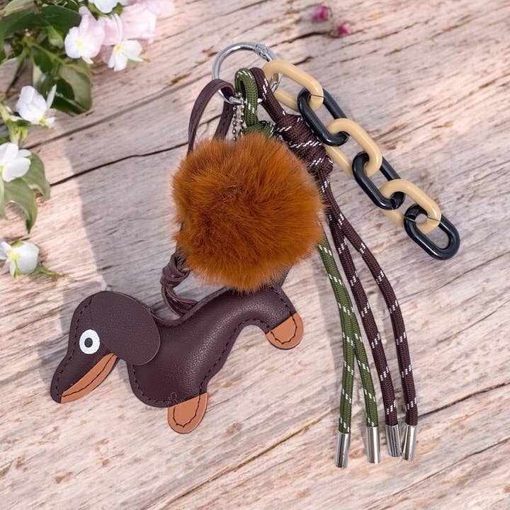 Brown Bag charm and keychain Dog and pompom PC11 for wholesale on Faire