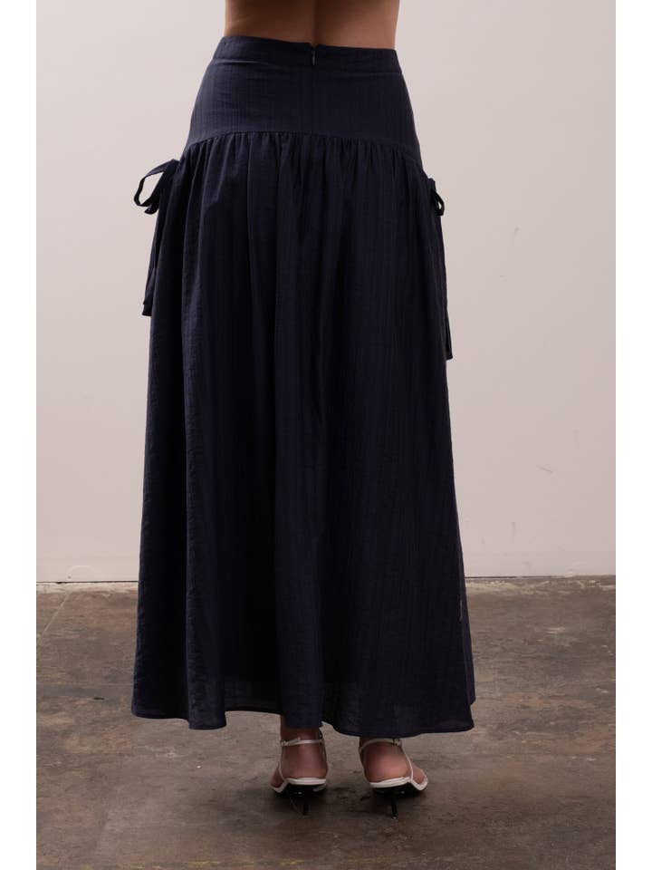 NAVY RIBBON SIDE DETAIL A-LINE MIDI SKIRT for wholesale on Faire