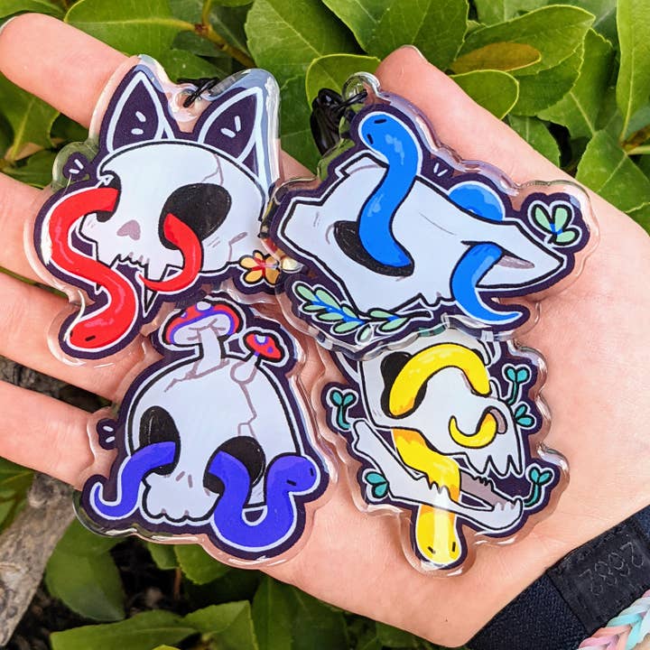 Snakes in Skulls Keychains for wholesale by Milky Tomato