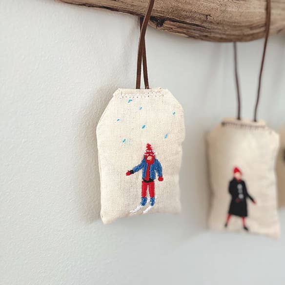 Kid Skiing Ornament (Assorted Colors) for wholesale by Saturna Outdoor Research