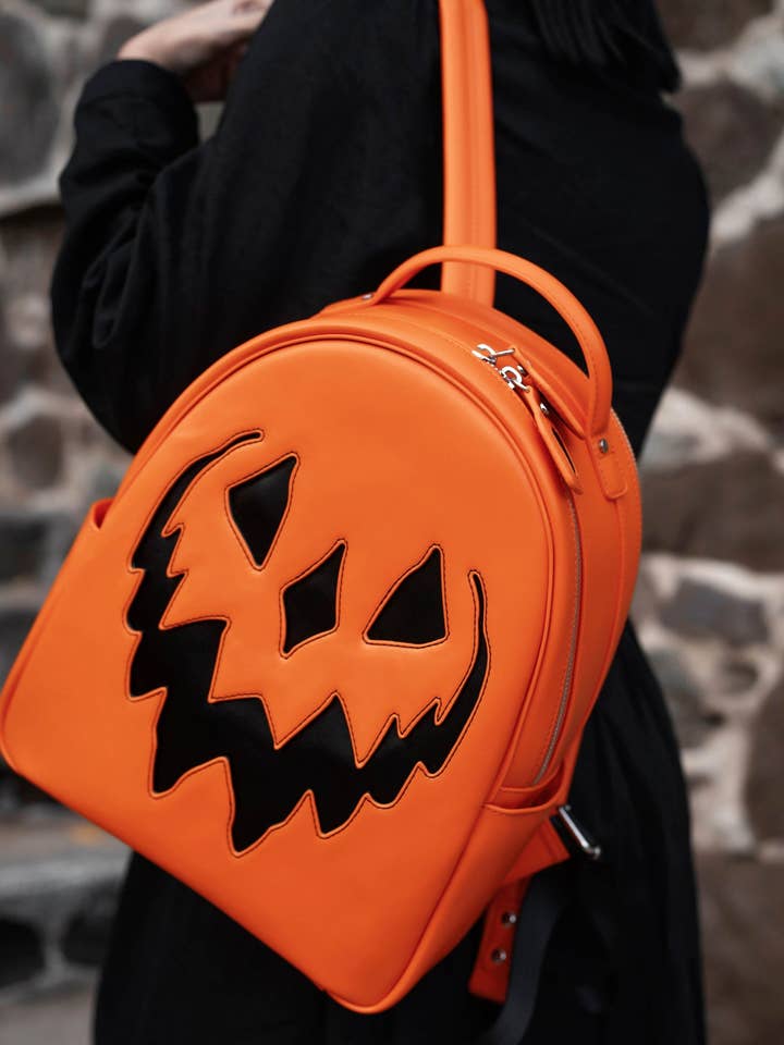 Orange Haunted Hallows Backpack for wholesale by Lively Ghosts
