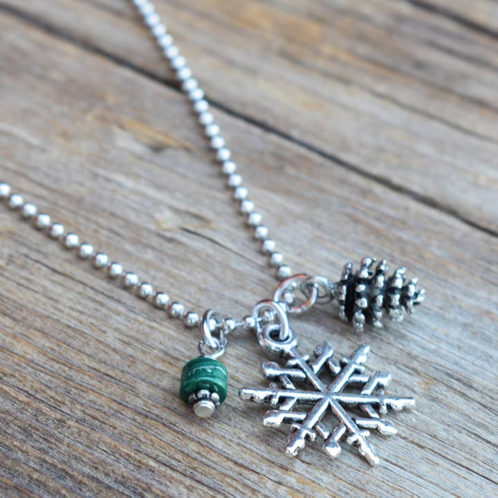Great Outdoors Snowflake, Pinecone & Malachite Necklace for wholesale by Cool Water Jewelry