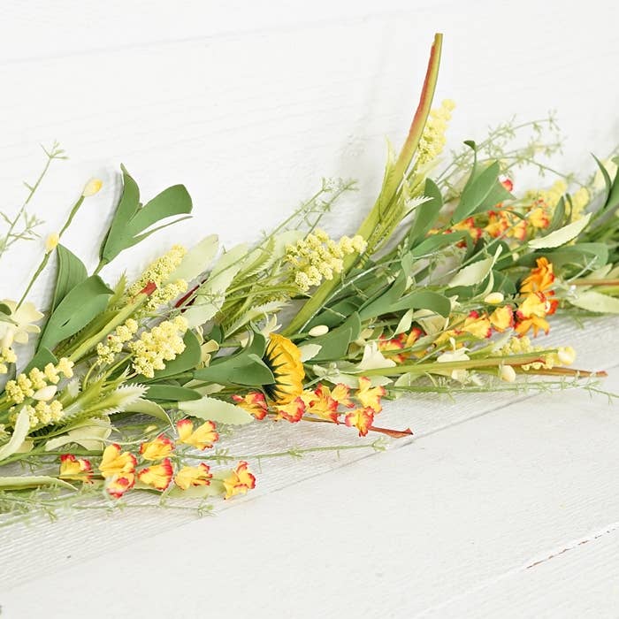 30991- 4ft Garland-Yellow Daisy with mountain flowers- for wholesale by Holiday Depot Inc.