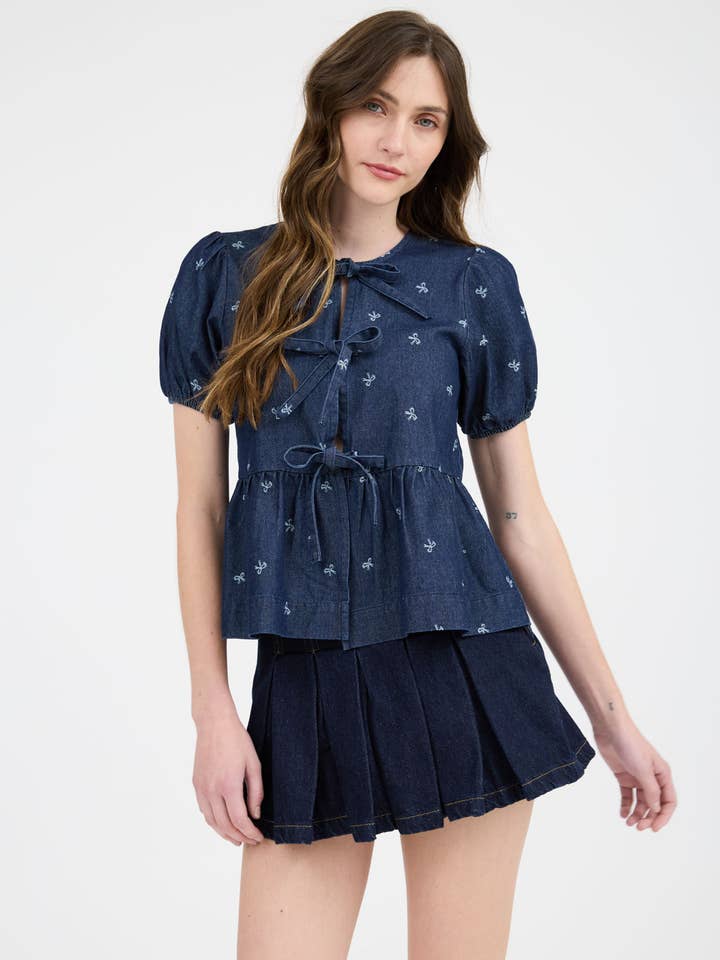 BOW PRINT PUFF SLEEVE FRONT SELF TIE RUFFLE HEM BLOUSE for wholesale by Blu Pepper