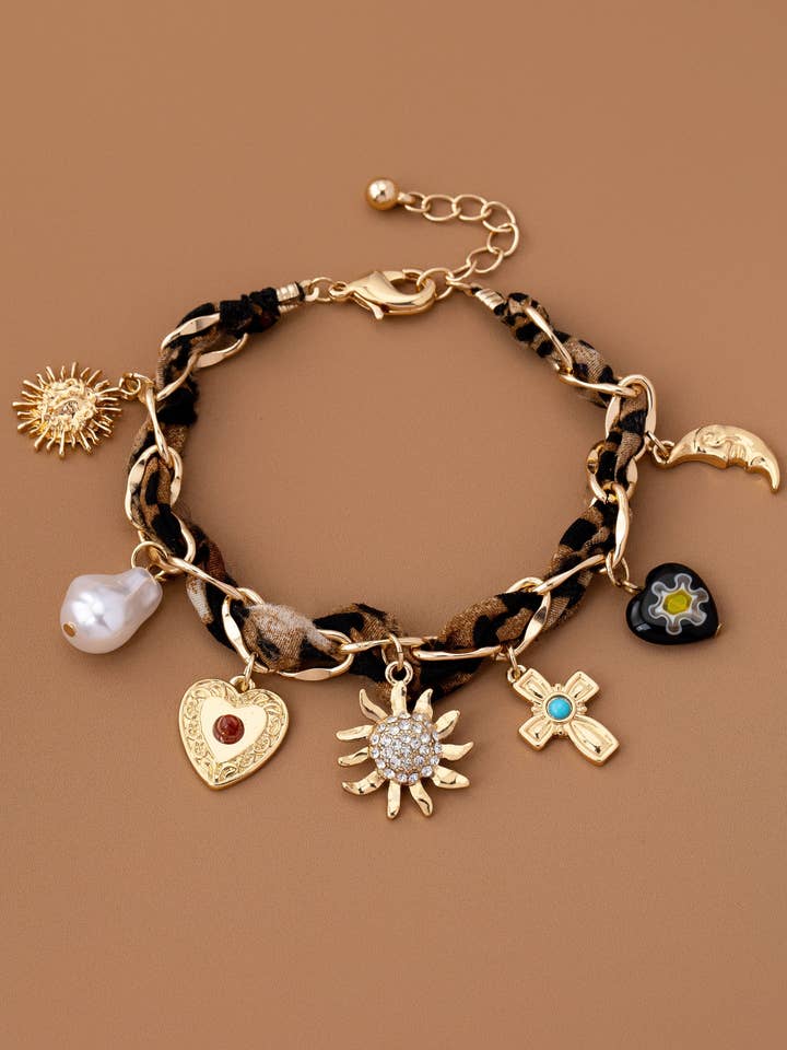 CHARM TØRKLÆDE ARMBÅND-KORS HERT SOLBLAST PERLE | 80B1574 for engroshandel hos JOSSLYN by wall to wall