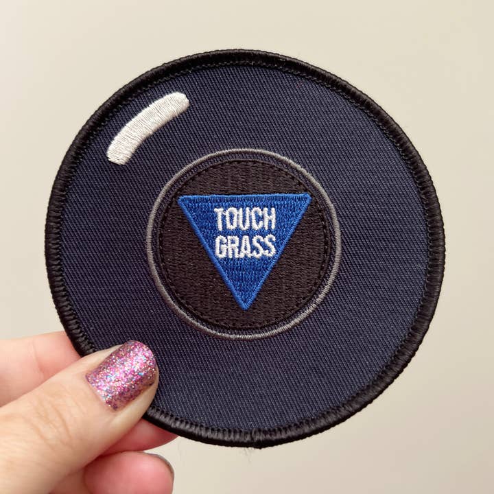 Touch Grass Magic 8-ball iron-on patch for wholesale by Chaos Engine (formerly Eyedot Creative)