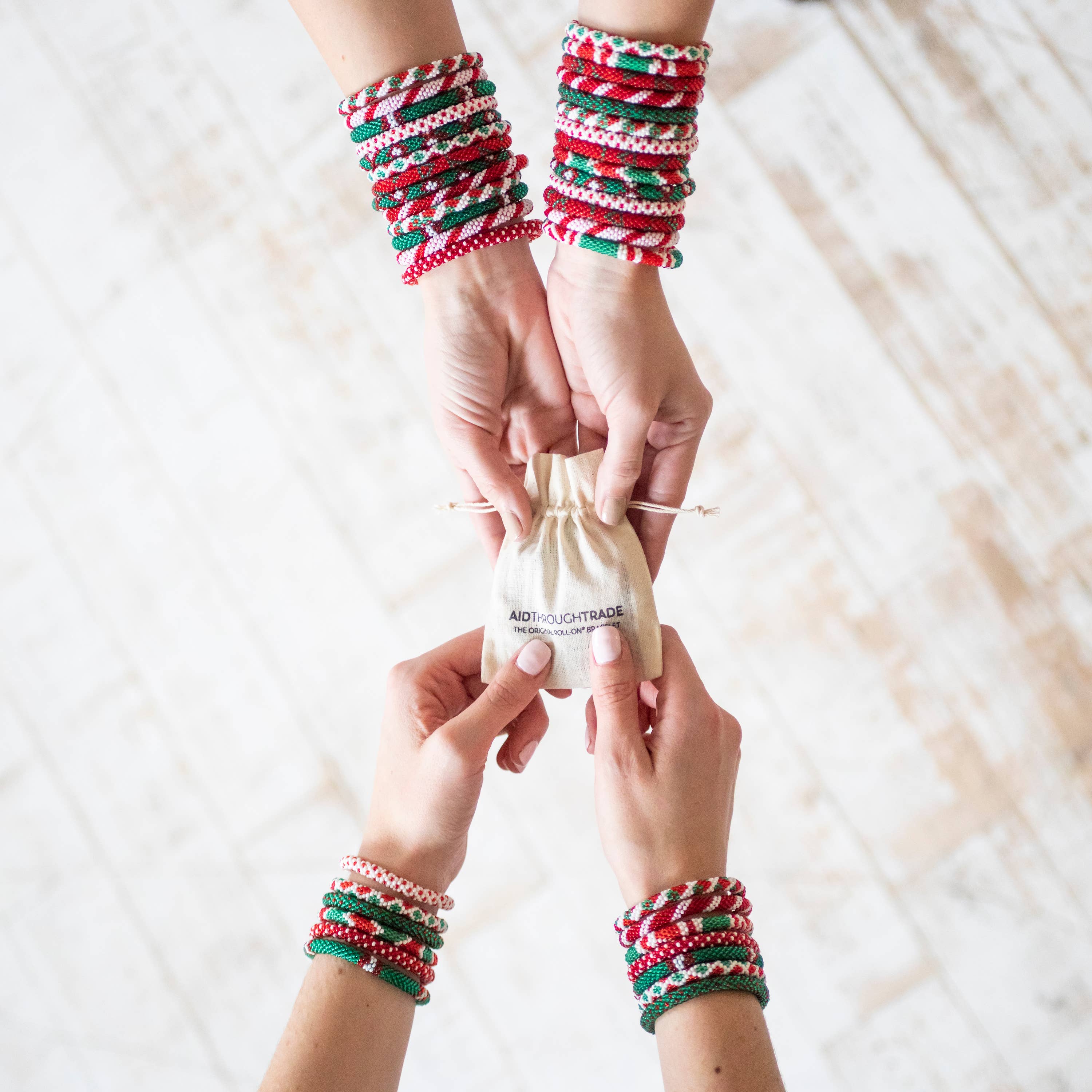 Aid Through Trade - Wholesale Jewelry Set - Roll-On® Christmas Bracelets (Mistletoe) - Set of 124