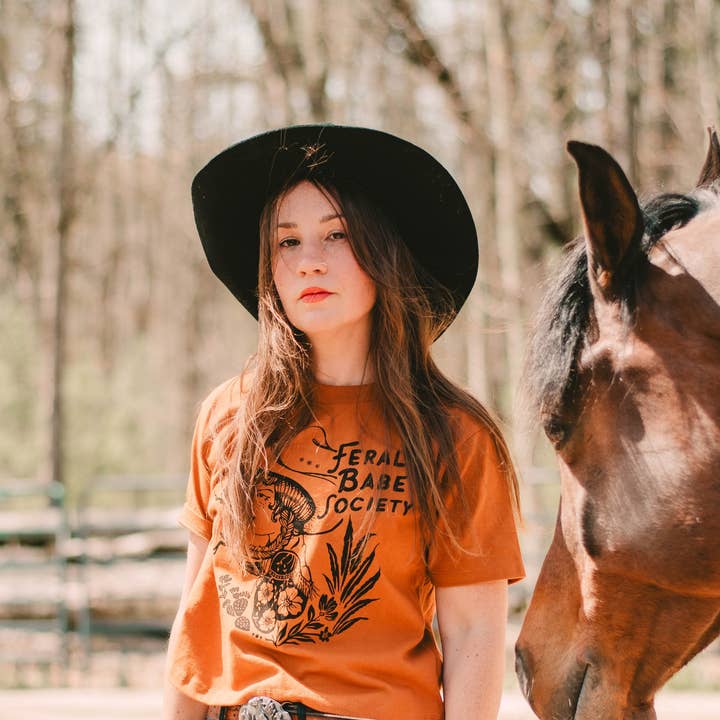 Feral Babe Society - Vintage Venom - Heavyweight Boxy Tee Rust and other Purchase Wholesale venom. Free Returns & Net 60 Terms on Faire trending on Faire.