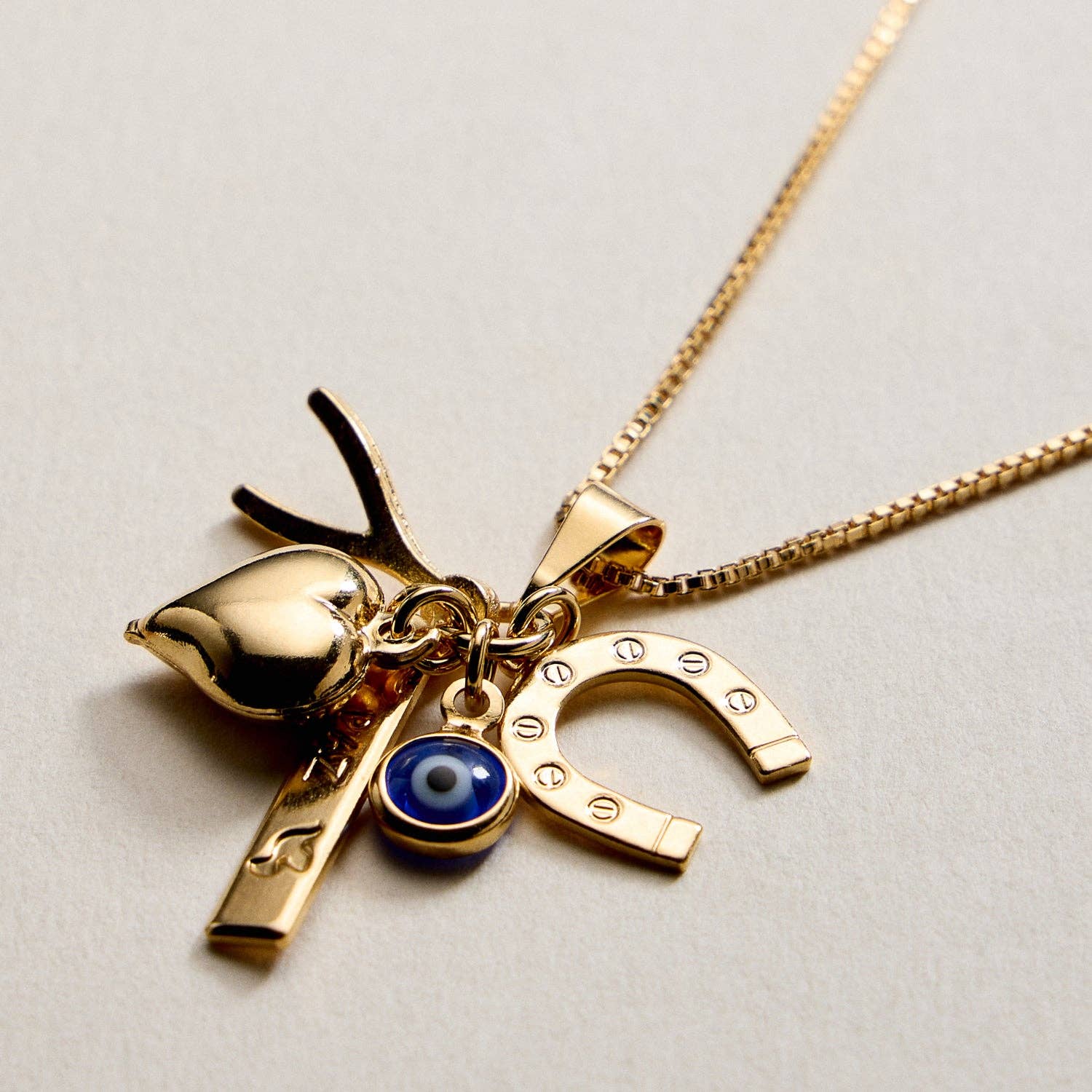 GD Gold Filled Charm Necklace – Heart, Horseshoe, Evil Eye & Wishbone Pendant for wholesale on Faire1