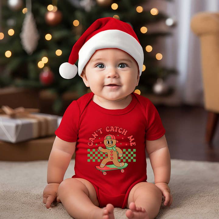 Gingerbread Man Skateboard | Baby Graphic Short Sleeve Onesie for wholesale by The Juniper Shop Wholesale