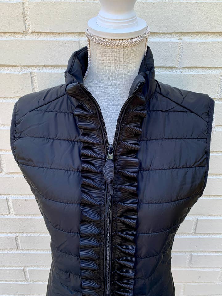 Maggie May Ruffle Puffer Vest - Black w Black Ribbon for wholesale on Faire