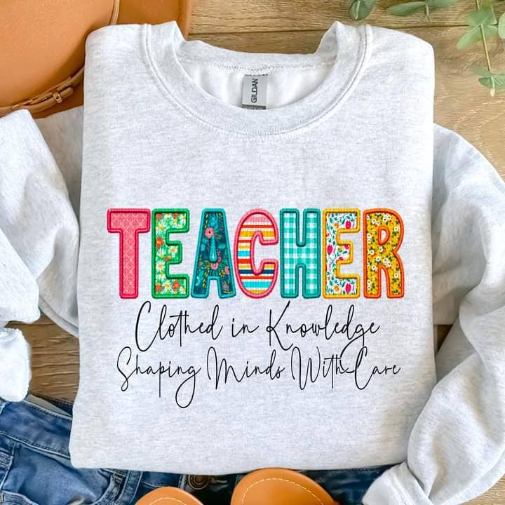 Teacher Clothed in Knowledge Tee or Crew for wholesale by Hello Sunshine Boutique