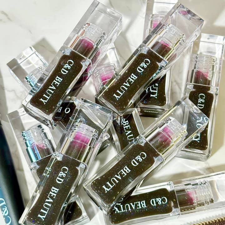 ECSTACY LIP OIL for wholesale by C & D Beauty LLC.