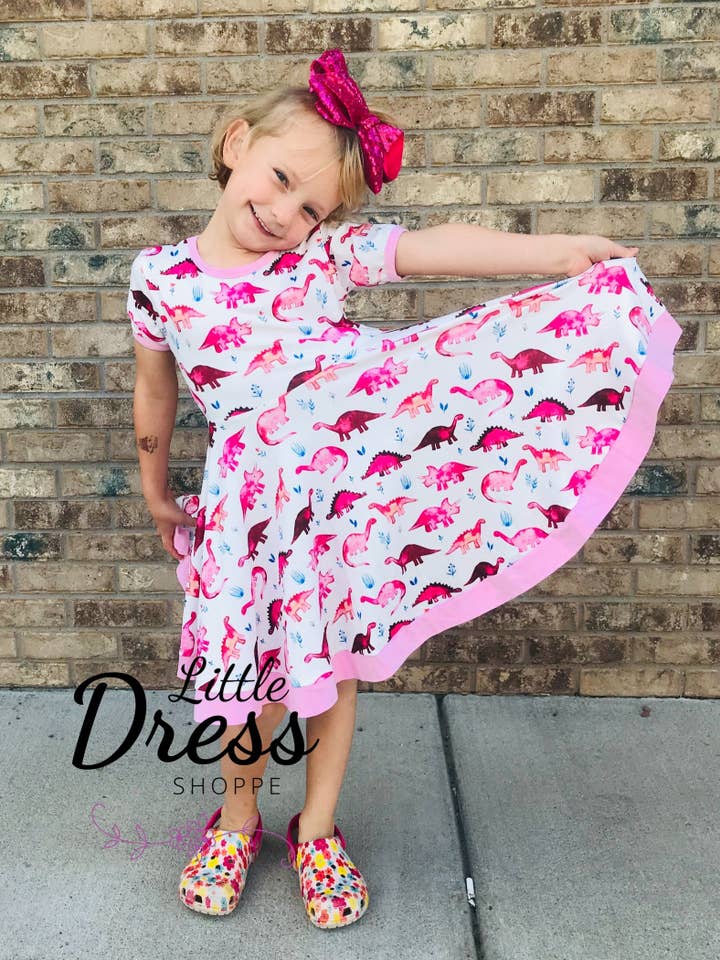 Pink Dinosaur Twirly Dress for wholesale by Little dress shoppe