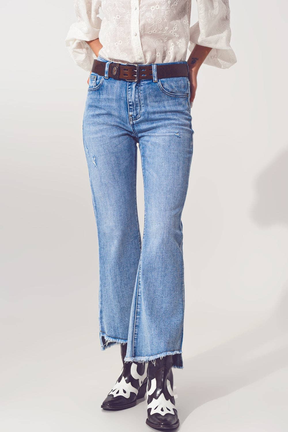 Flared Jeans in Light Blue with Asymmetric Hem for wholesale on Faire4