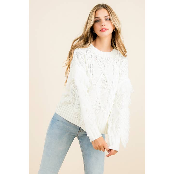 Pull en tricot torsadé à franges pour la vente par THML