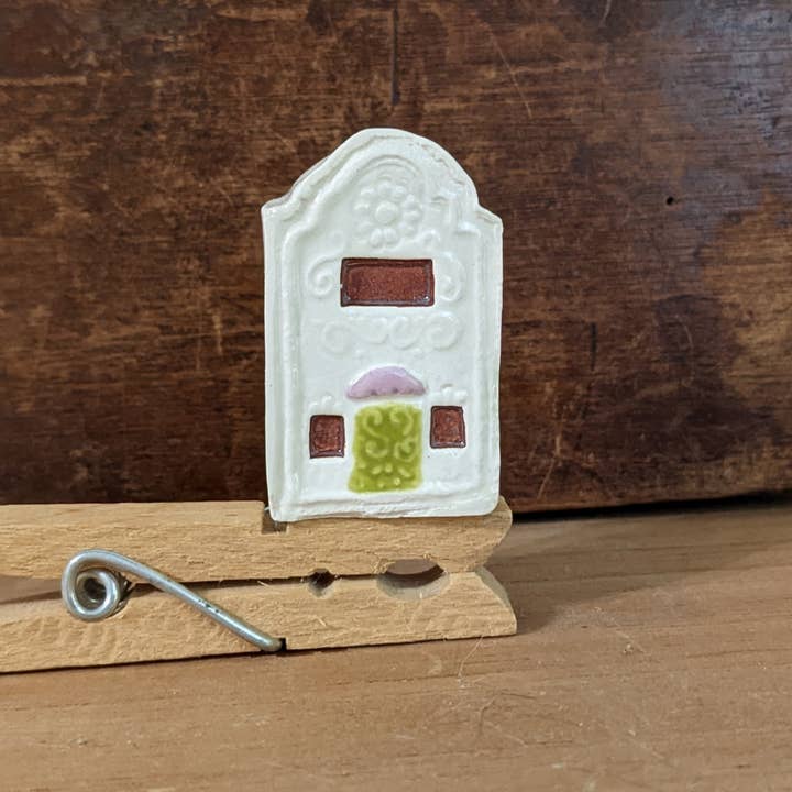 Thumb-sized miniature white ceramic house with green door for wholesale by CurlyFernCeramics