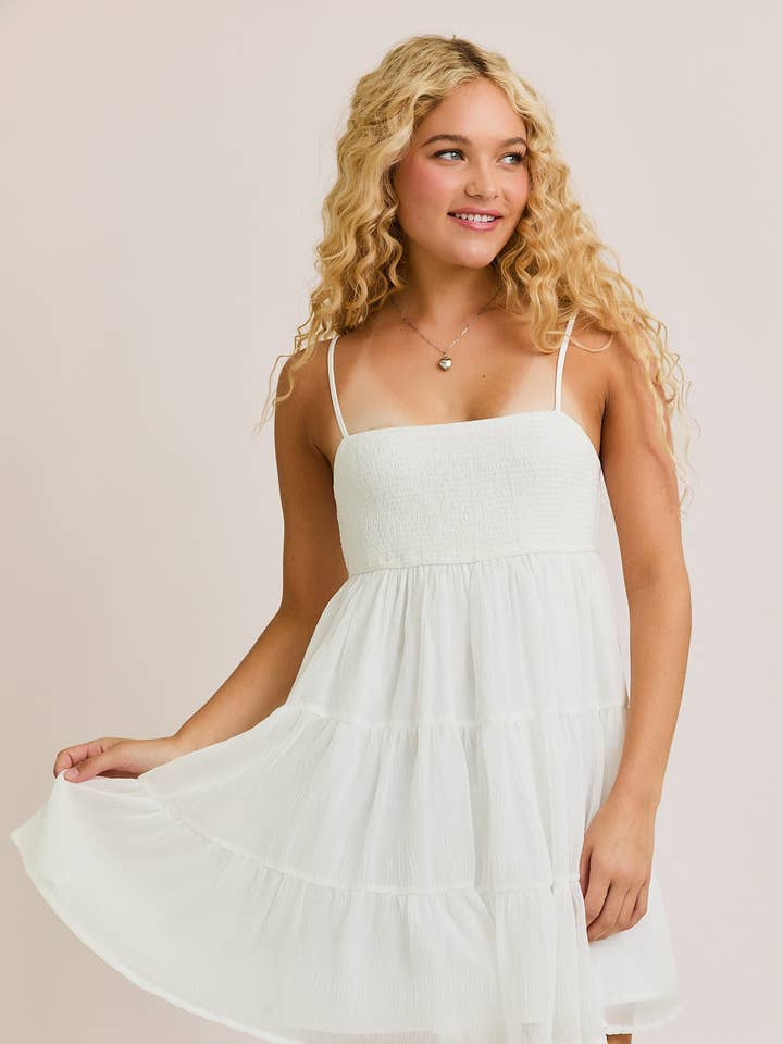 White SMOCKED TIERED MINI DRESS for wholesale on Faire