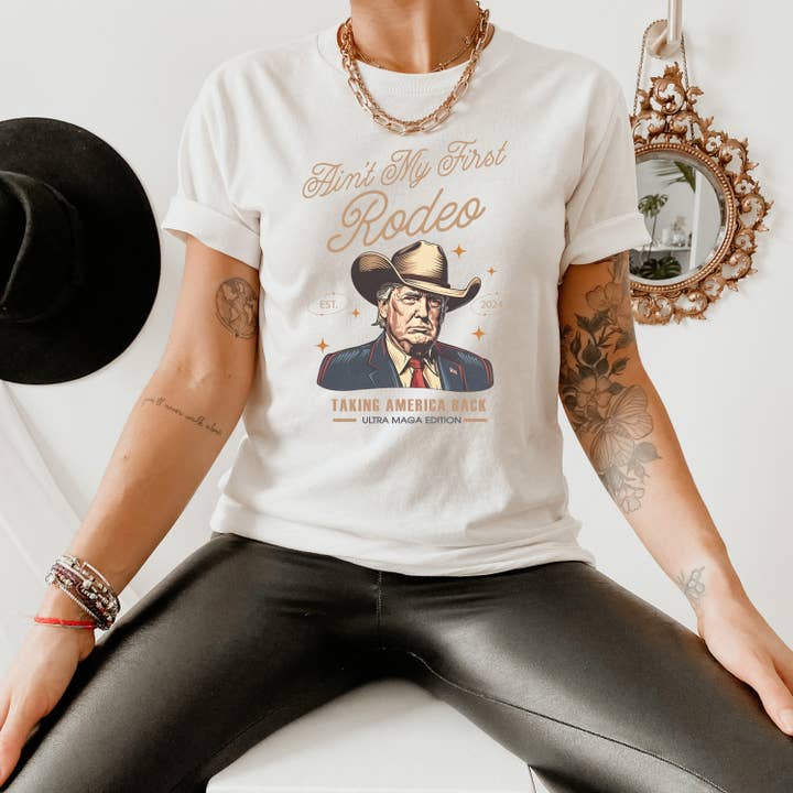 NVC Ecommerce LLC - Wholesale T-Shirt (Graphic) - Women's - Donald Trump Tee, Ain't My First Rodeo Tee, Trump Cowboy Tee