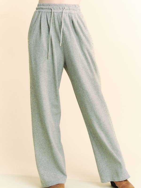Grigio PANTALONI LUNGHI IN FELPA CON ELASTICO IN VITA CON STRASS in vendita all'ingrosso su Faire