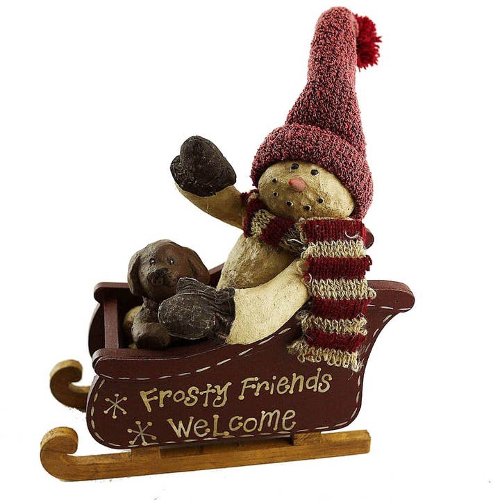 Schneemann aus Pappmaché „Frosty Friends Welcome“ mit Welpen auf Schlitten mit Stoffmütze und Schal — 6,5" groß für den Großhandel von Birch Maison