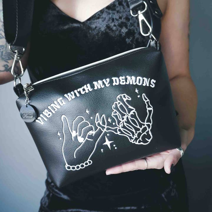 Black Embroidered Vibing with my Demons Small Crossbody Bag for wholesale by Project Pinup