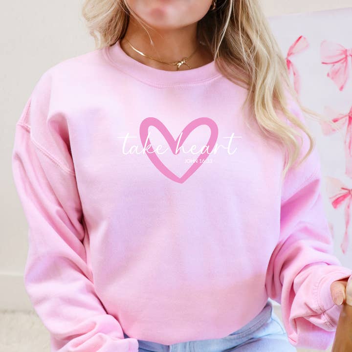 Sweatshirt de la Saint-Valentin chrétien "Take Heart Cozy Crewneck" pour la vente par Faith & Life Christian Brands