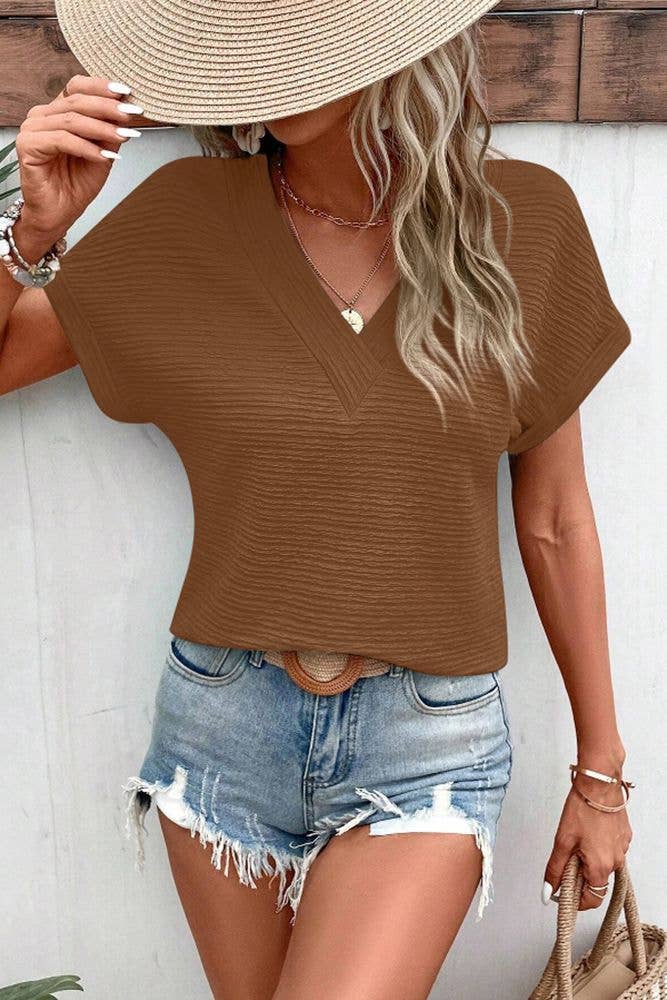 UNISHE - Venta al por mayor Jersey corto de punto - Mujer - Top de manga corta con cuello en V con textura lisa ZK158922