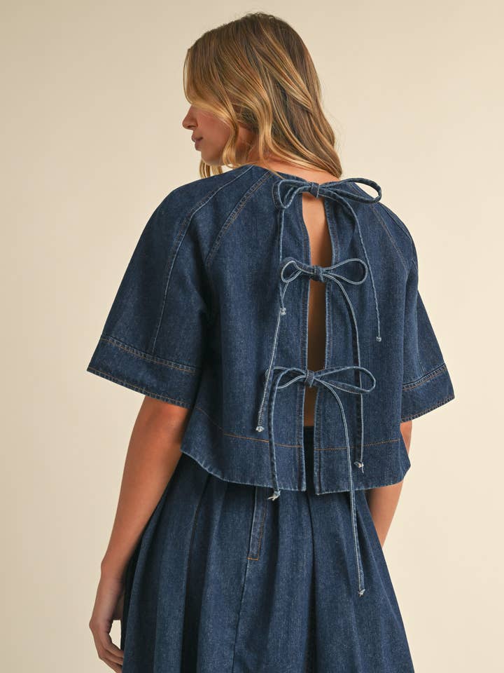 IT4079-A DENIM SHORT SLEEVE TOP WITH OPEN TIED BACK DETAIL for wholesale on Faire