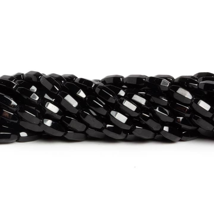 The Bead Traders – wholesale Beads – 9x4mm Black Onyx Faceted Tubes 15 inch 48 beads
