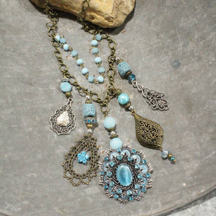 The Primitive Peddler, Inc. - Wholesale Pendant/Charm Necklace - Embellishments Of Bronze & Silver Charming Blue Pendant Layered Necklace