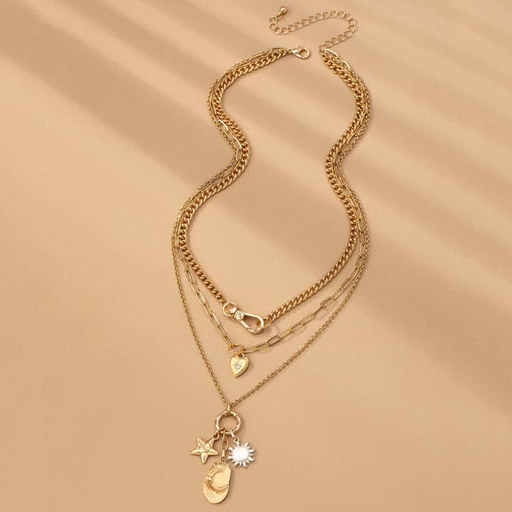 GOLD MULTI LAYER CELESTIAL STAR MOON CHARM NECKLACE | 80N92439 for wholesale on Faire4