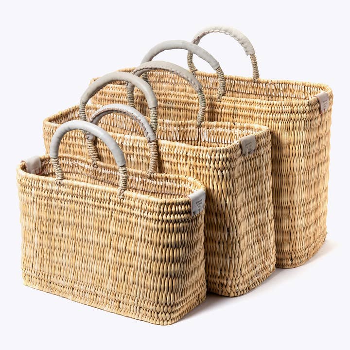 Handwoven basket with leather-wrapped handles. for wholesale by HandHappiness