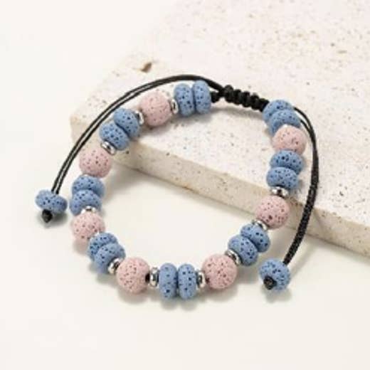 Bracelets made of round and flat beads in natural lava stone for wholesale by INNOBIZ