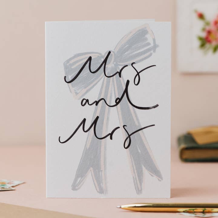 'Mrs and Mrs' Bow Handwriting LGBTQ+ Wedding Card for wholesale by Oh Squirrel