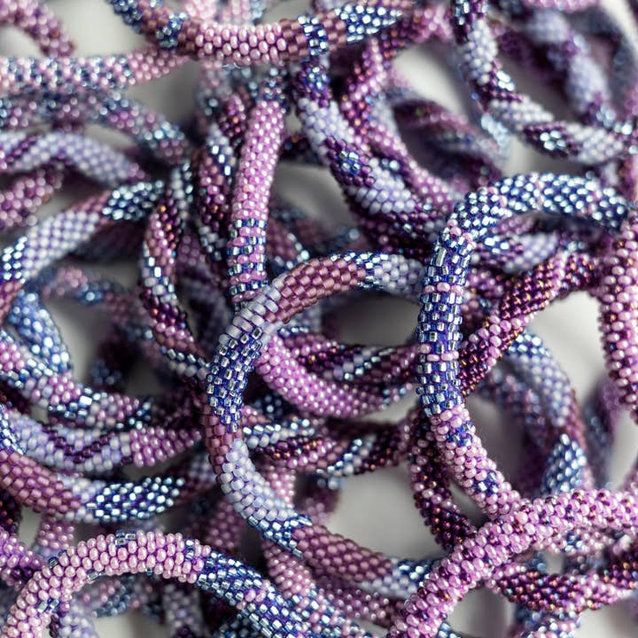 Aid Through Trade - Wholesale Jewelry Set - The Original Roll-On® Bracelet Amethyst - Set of 12
