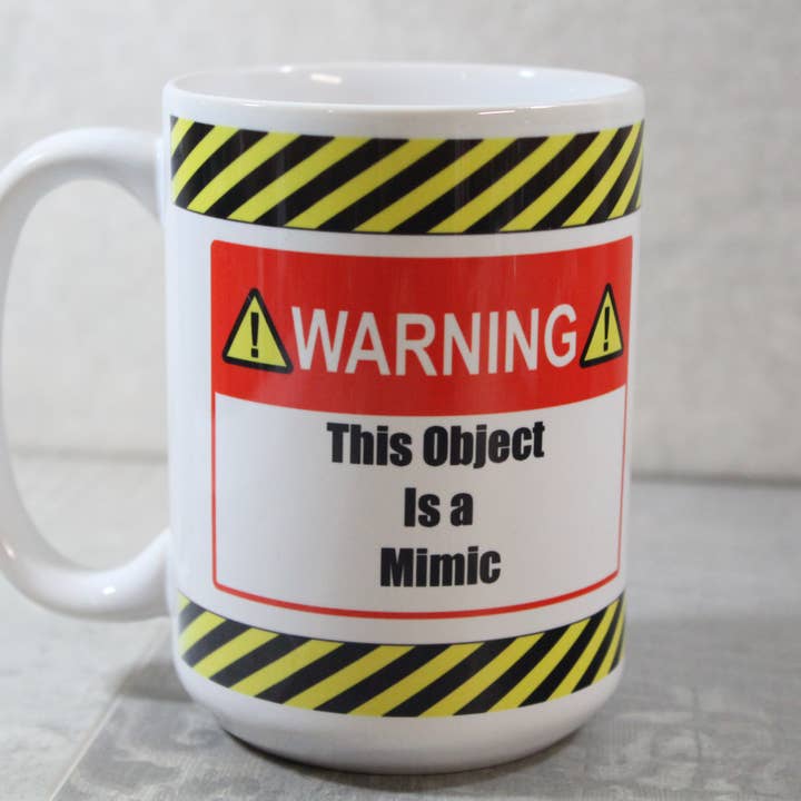 Dette objekt er en efterligne D&D//15 ounce Keramisk krus for engroshandel hos Raven Design