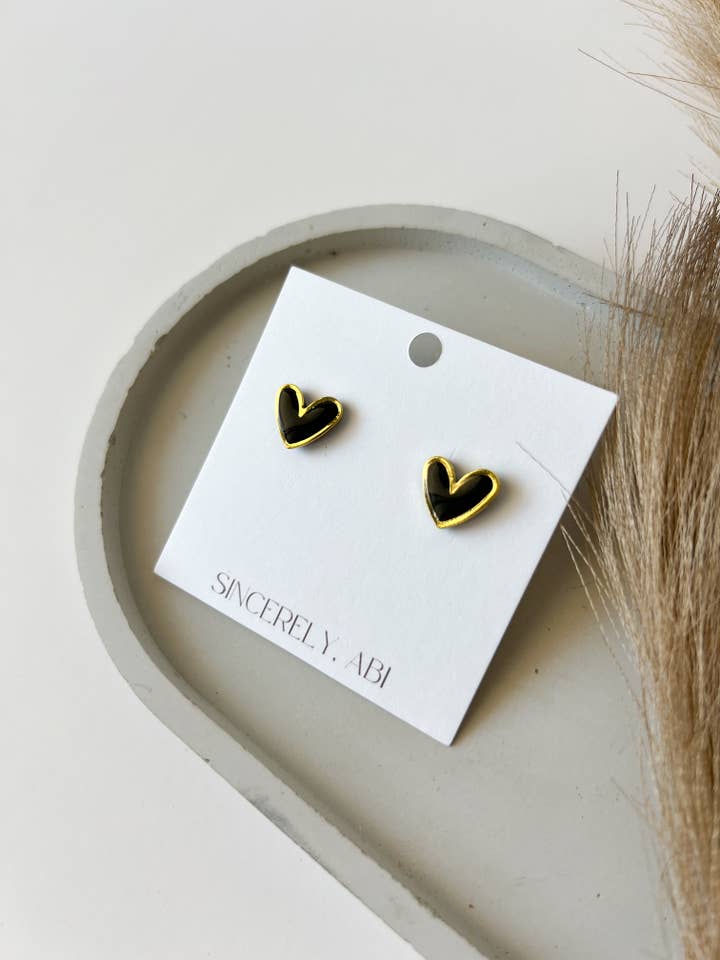 Gold Trim Heart Studs, Black for wholesale by Sincerely, Abi